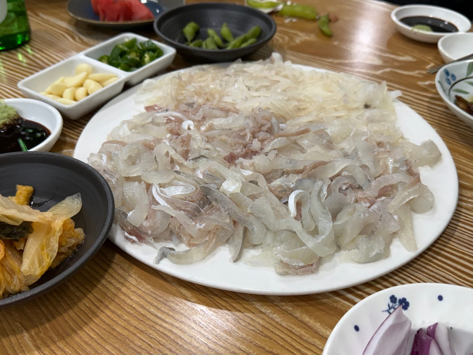 Filefish and squid sashimi on a large plate