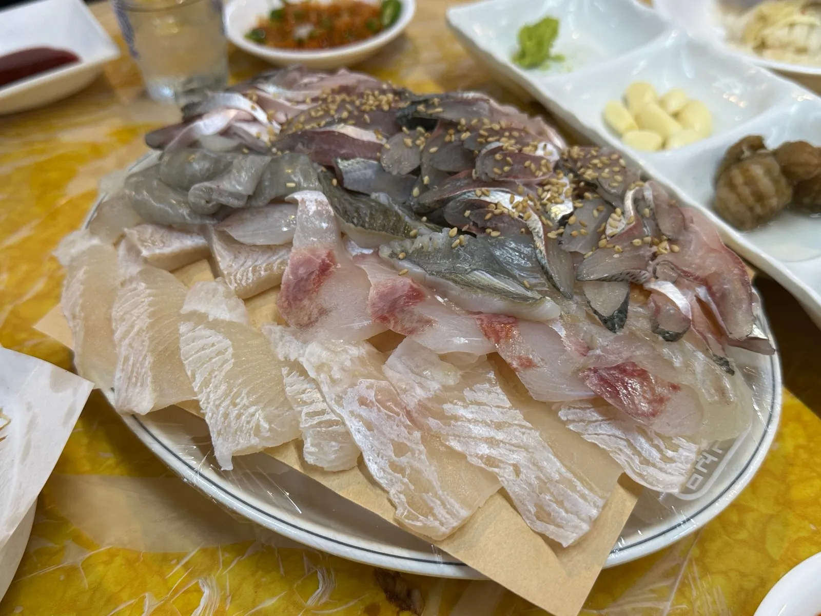 A large platter of gizzard shad and white-fleshed sashimi