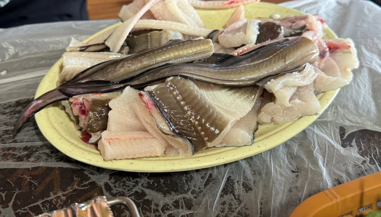 Cleaned sea eel heaped on a light green plate